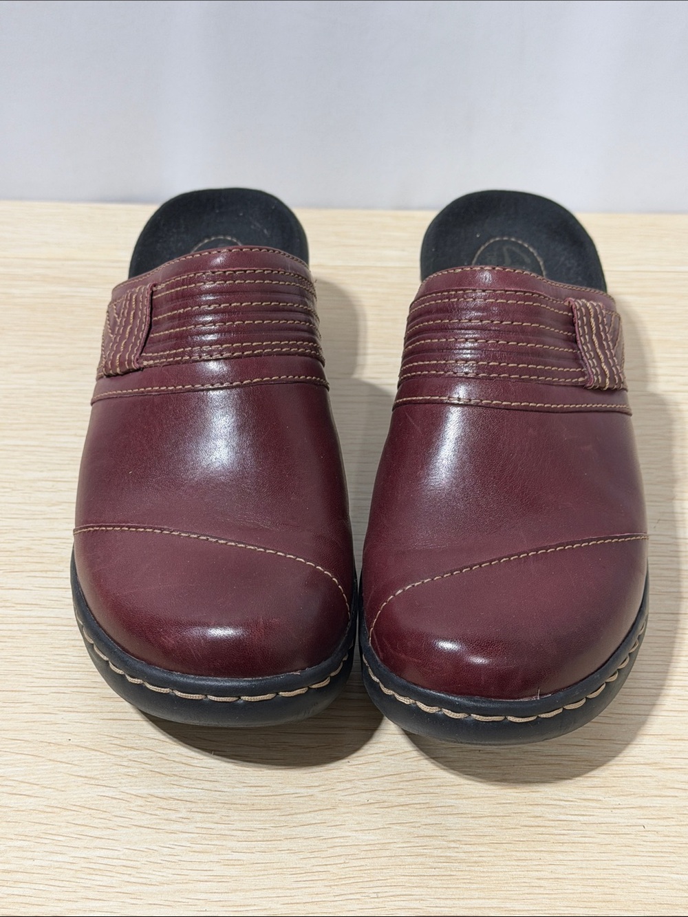 Clark’s Slip-On Leather Clogs in Burgundy.